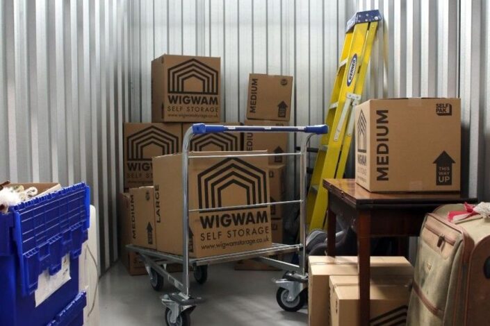 Student storage unit with Wigwam boxes luggage and personal items